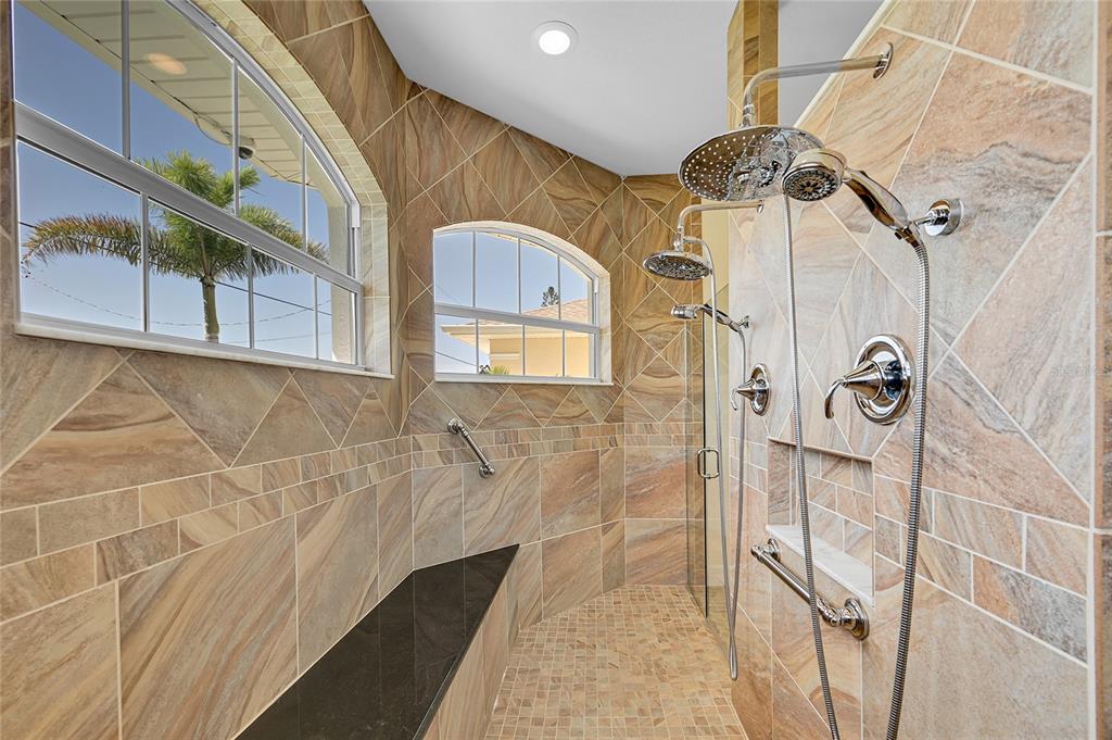233 Fairway Road Rotonda West, FL 33947 - Photo 34 of 63 a bathroom with a bathtub and shower