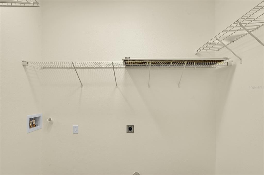 233 Fairway Road Rotonda West, FL 33947 - Photo 36 of 63 a view of a room with racks on the wall