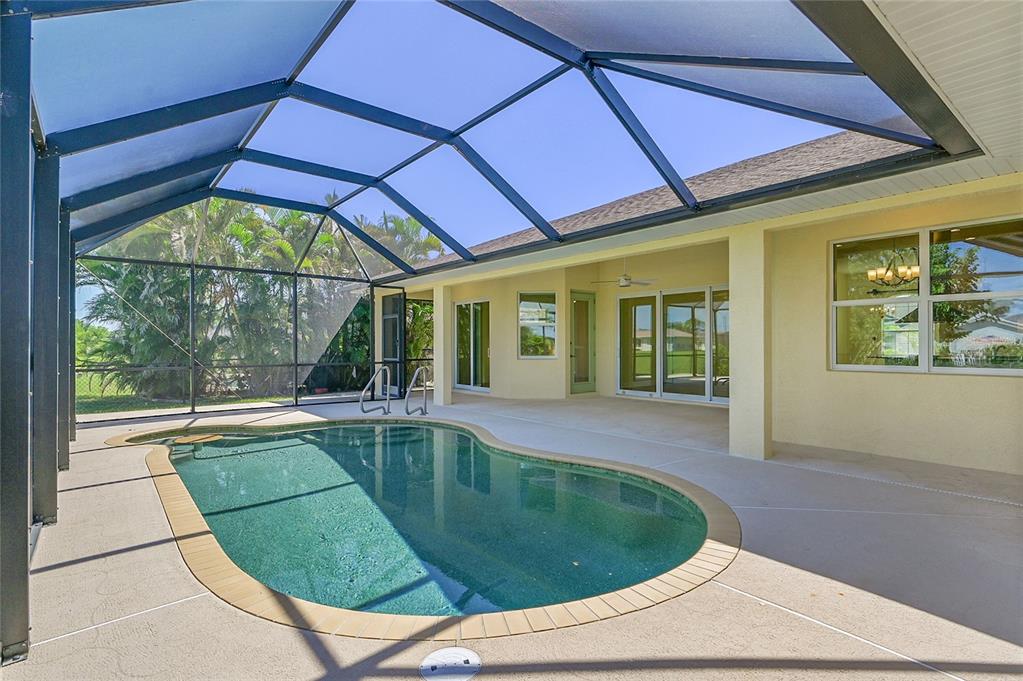 233 Fairway Road Rotonda West, FL 33947 - Photo 42 of 63 a view of a backyard with a swimming pool