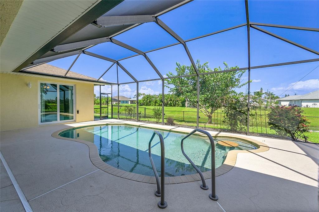 233 Fairway Road Rotonda West, FL 33947 - Photo 43 of 63 a view of a swimming pool with a patio