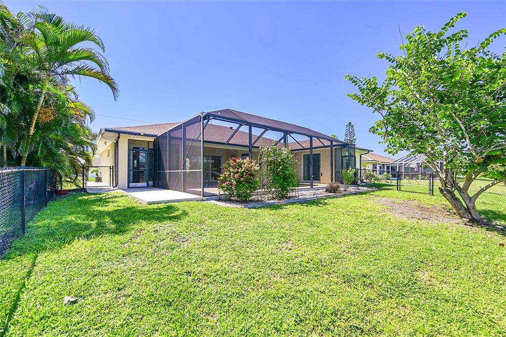233 Fairway Road Rotonda West, FL 33947 - Photo 46 of 63 a view of a house with a yard