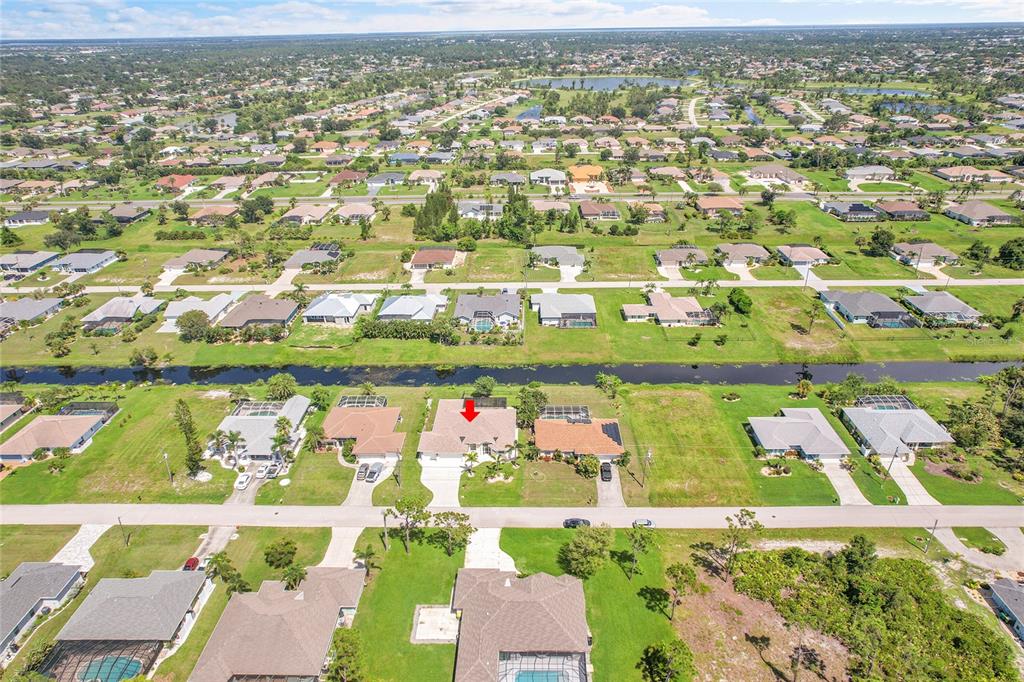 233 Fairway Road Rotonda West, FL 33947 - Photo 61 of 63 an aerial view of residential houses with outdoor space and street view