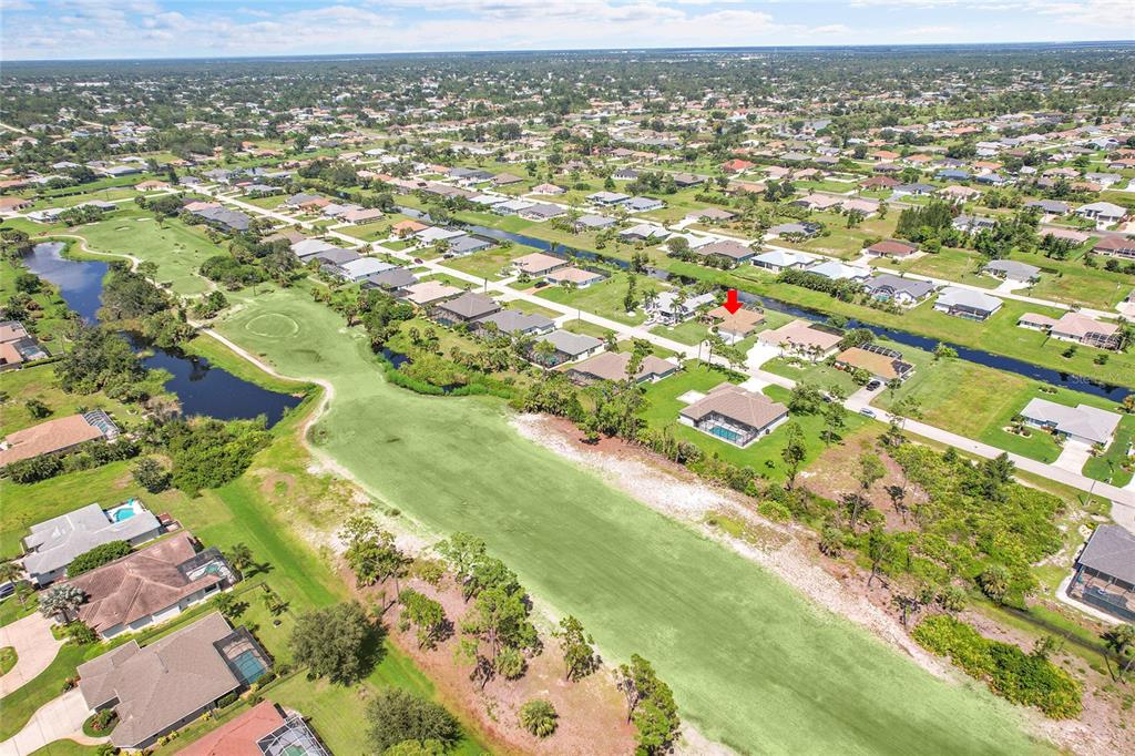 233 Fairway Road Rotonda West, FL 33947 - Photo 62 of 63 an aerial view of residential houses with outdoor space