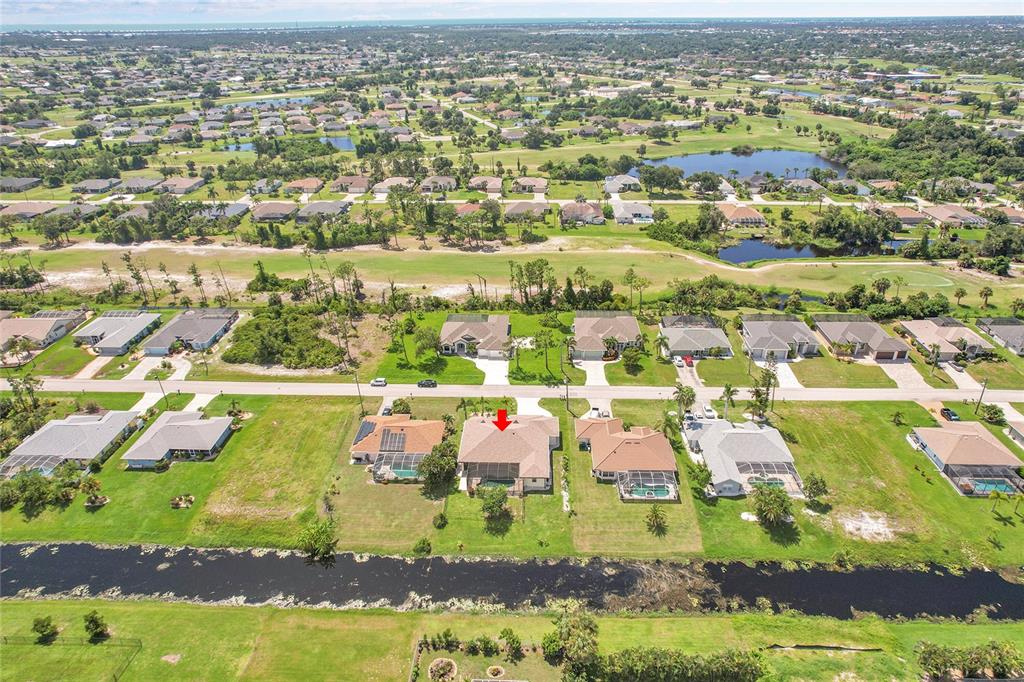 233 Fairway Road Rotonda West, FL 33947 - Photo 63 of 63 an aerial view of residential houses with outdoor space