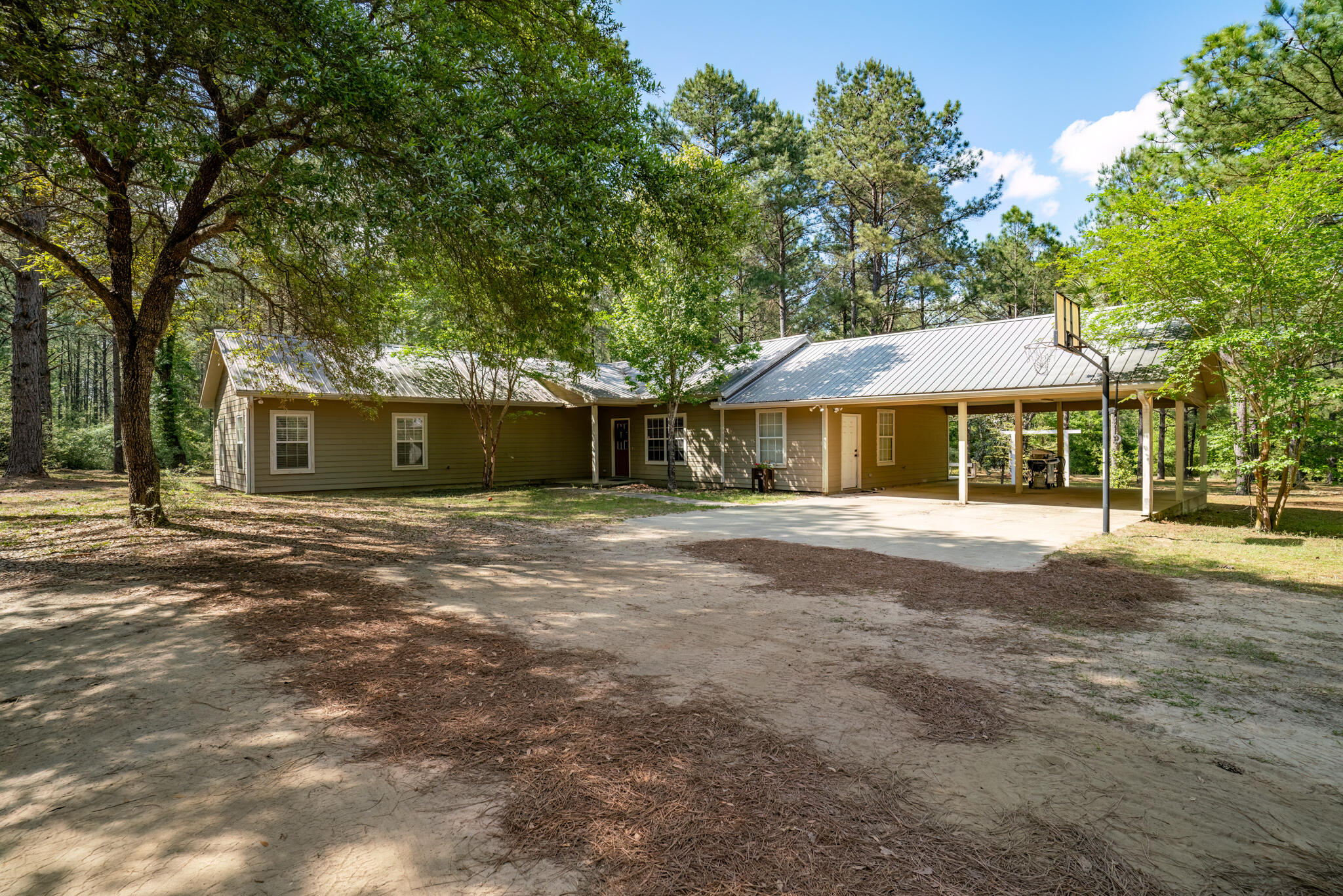 4353 Poverty Creek Road Crestview, FL 32539 - Photo 12 of 43 a front view of a house with a yard and garage