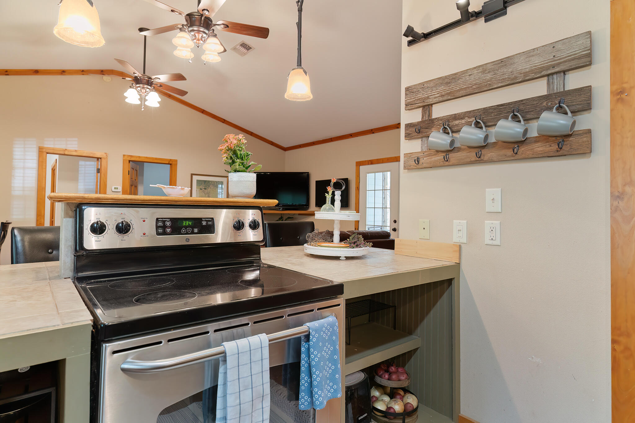 4353 Poverty Creek Road Crestview, FL 32539 - Photo 15 of 43 a kitchen with a stove and a microwave