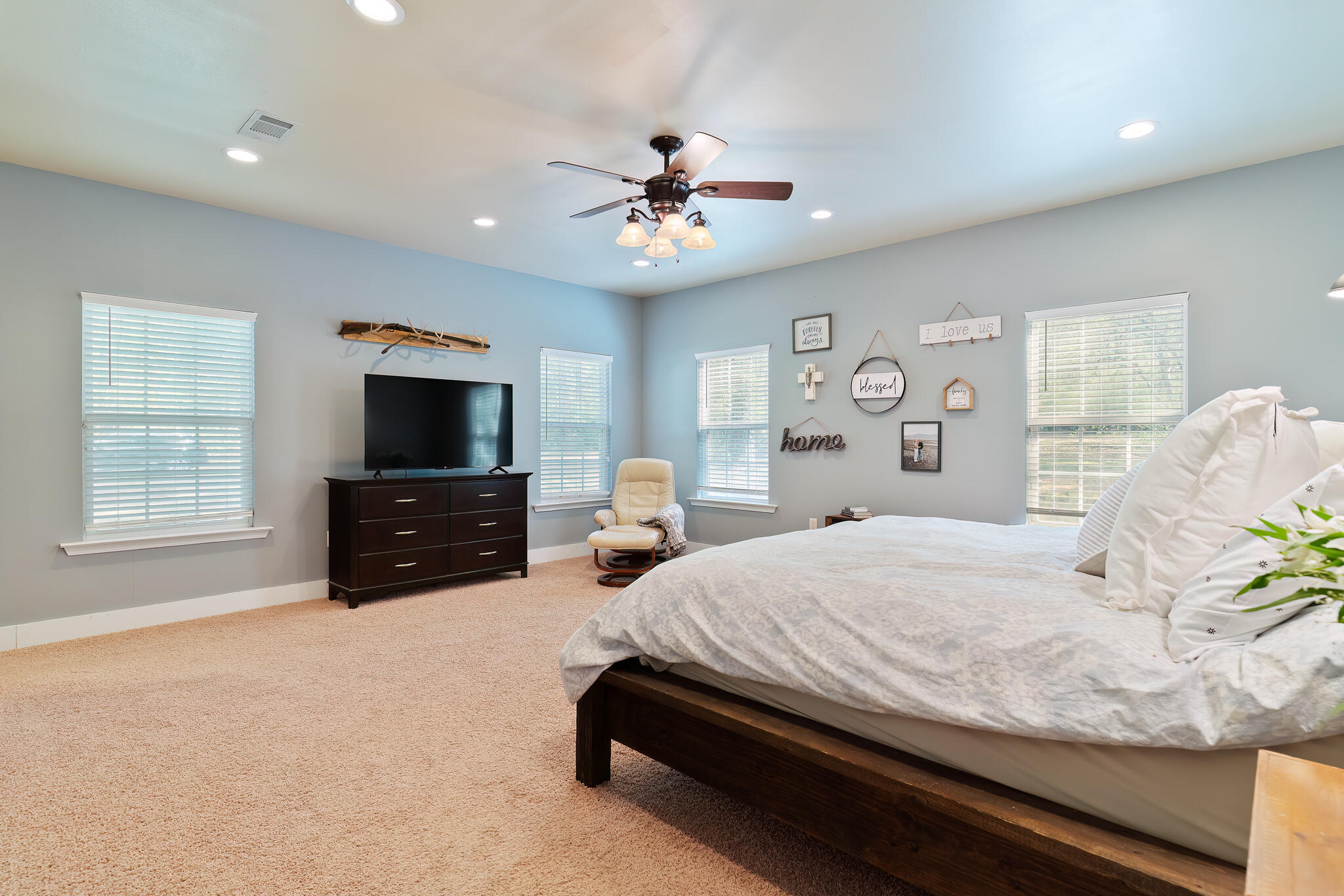 4353 Poverty Creek Road Crestview, FL 32539 - Photo 23 of 43 a bedroom with a bed and a flat screen tv