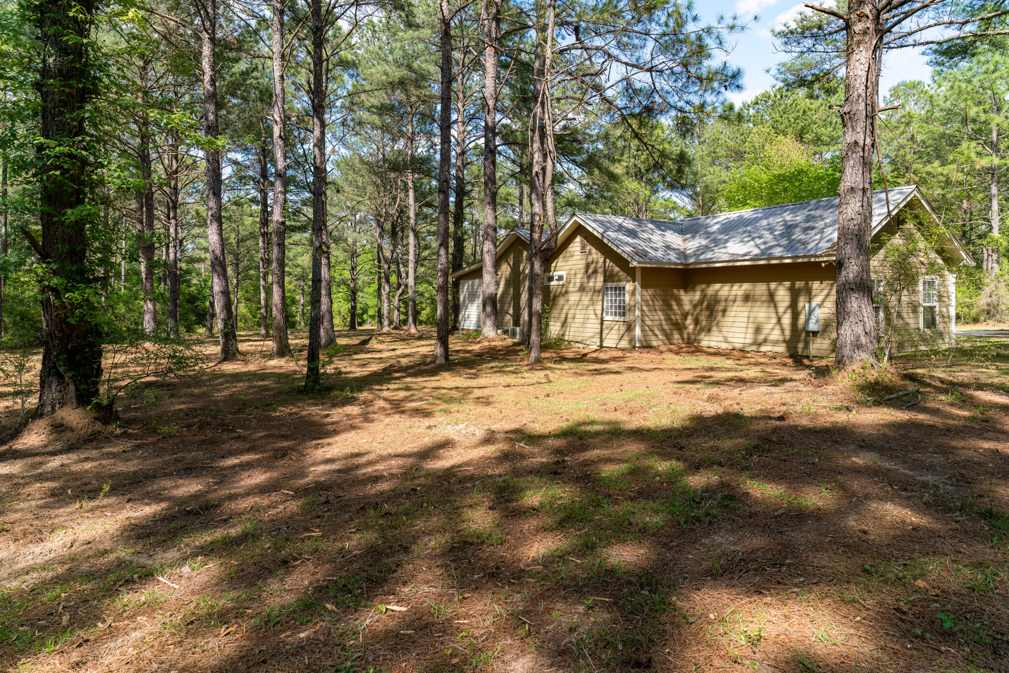 4353 Poverty Creek Road Crestview, FL 32539 - Photo 43 of 43 a view of outdoor space with deck and tree