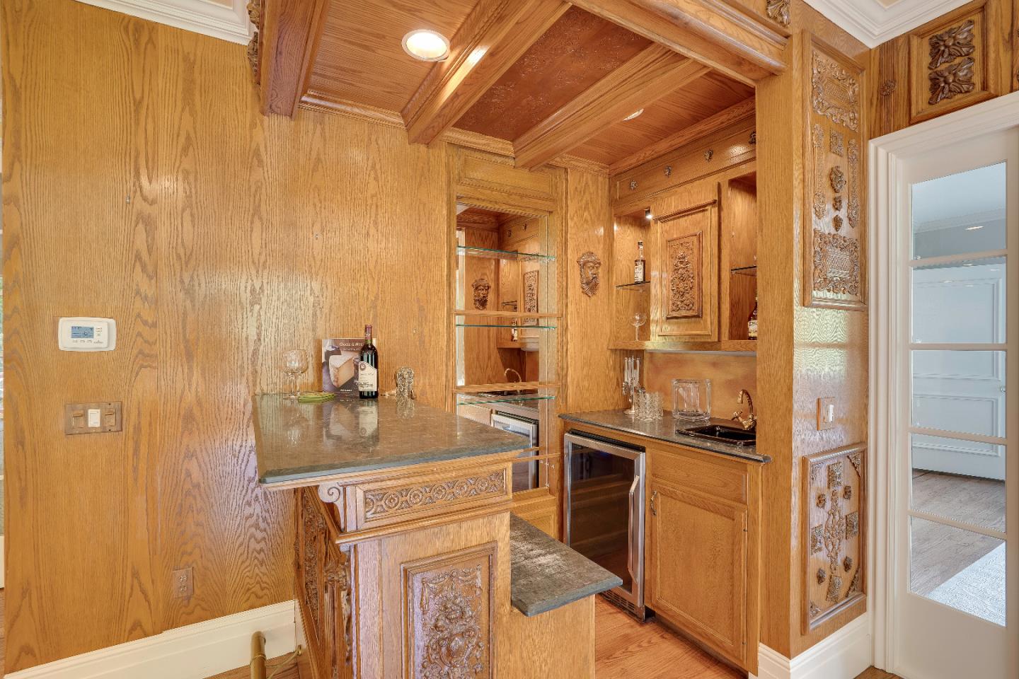 843 Chiltern Road Hillsborough, CA 94010 - Photo 17 of 94 a kitchen with stainless steel appliances granite countertop a refrigerator and a stove