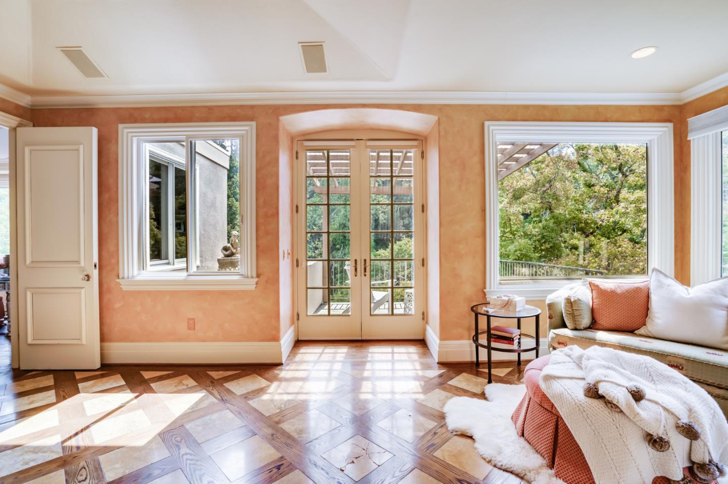 843 Chiltern Road Hillsborough, CA 94010 - Photo 46 of 94 a living room filled with furniture and floor to ceiling windows