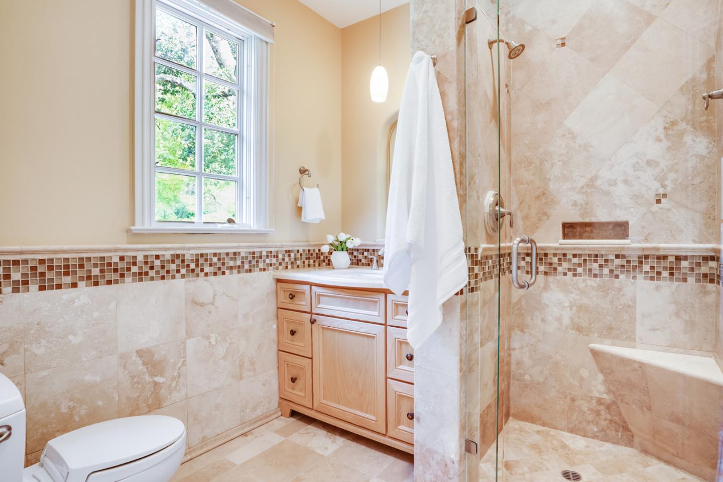 843 Chiltern Road Hillsborough, CA 94010 - Photo 61 of 94 a bathroom with a sink a toilet and a shower