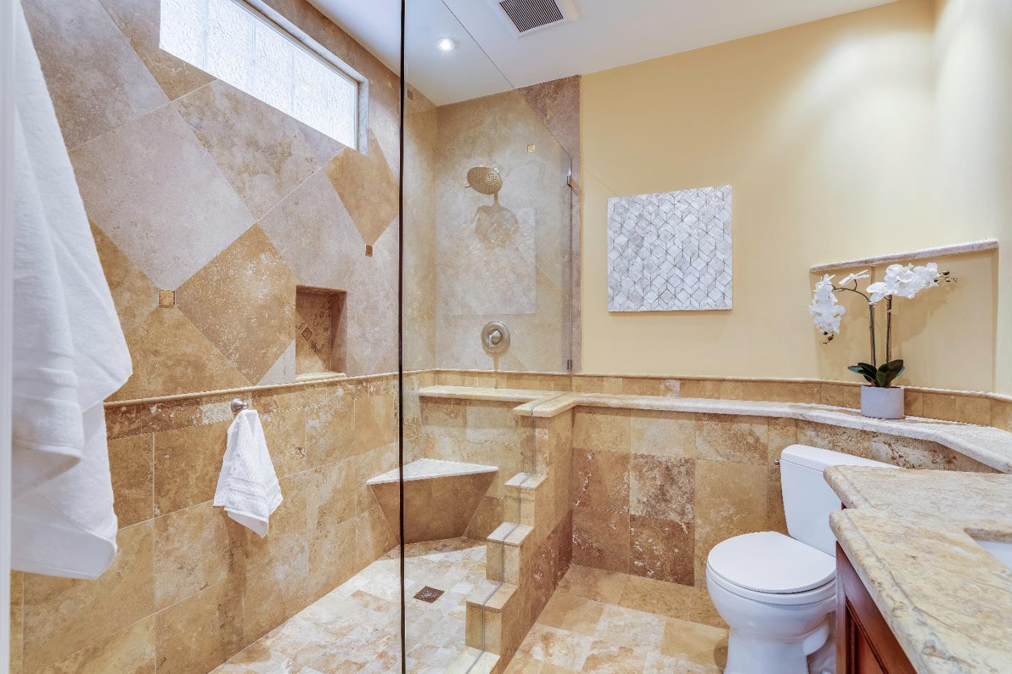 843 Chiltern Road Hillsborough, CA 94010 - Photo 73 of 94 a bathroom with a granite countertop sink toilet and a mirror