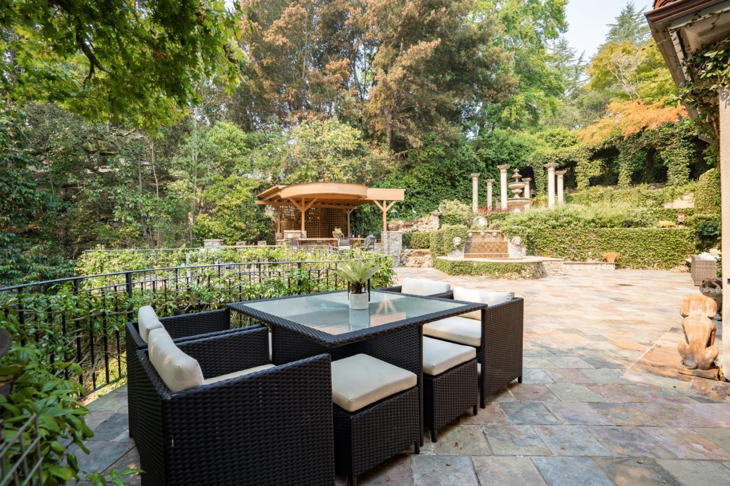 843 Chiltern Road Hillsborough, CA 94010 - Photo 81 of 94 a view of a patio with table and chairs and potted plants