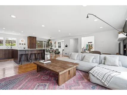 a living room with furniture and a table