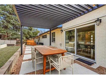 a patio with table and chairs