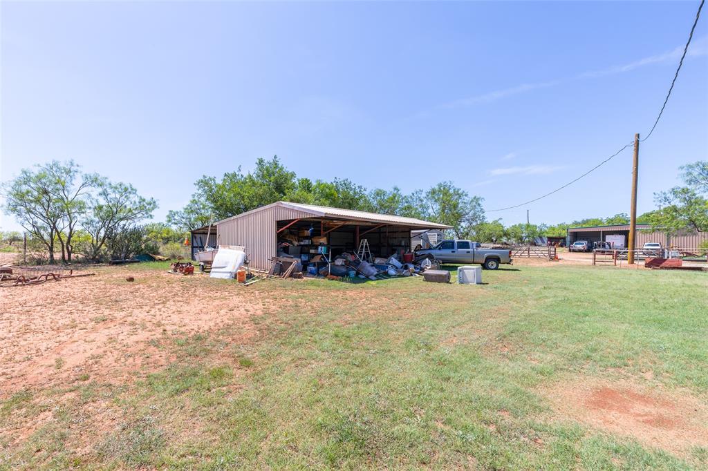 6702 West Lake Road Abilene, TX 79601 - Photo 7 of 21 a swimming pool with outdoor seating and yard