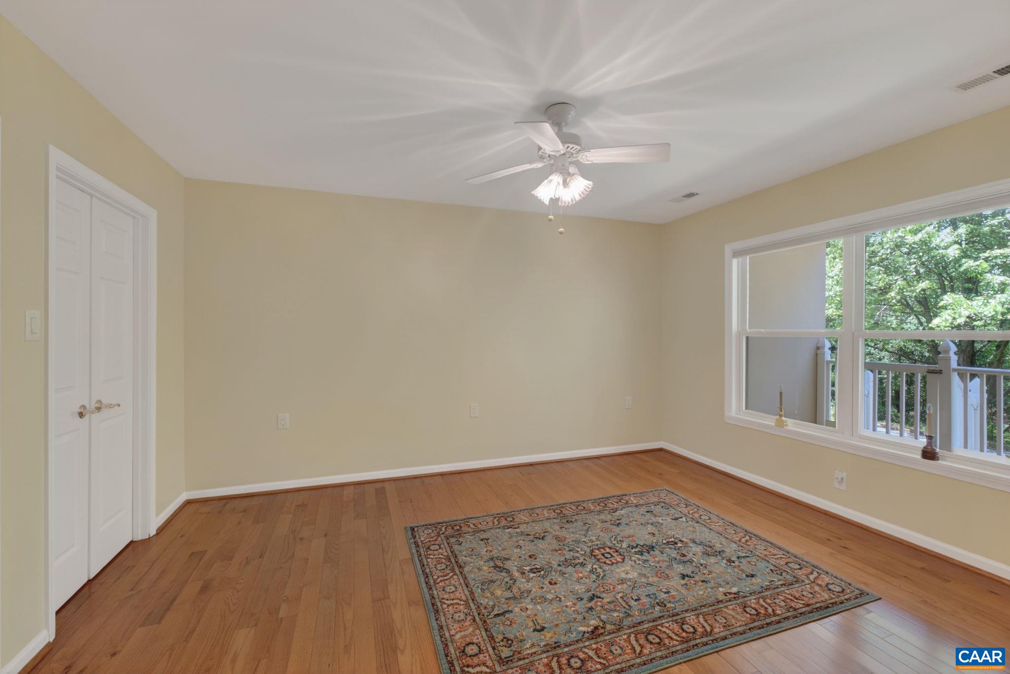 590 Mockingbird Way Charlottesville, VA 22901 - Photo 29 of 43 a view of an empty room with wooden floor and a window