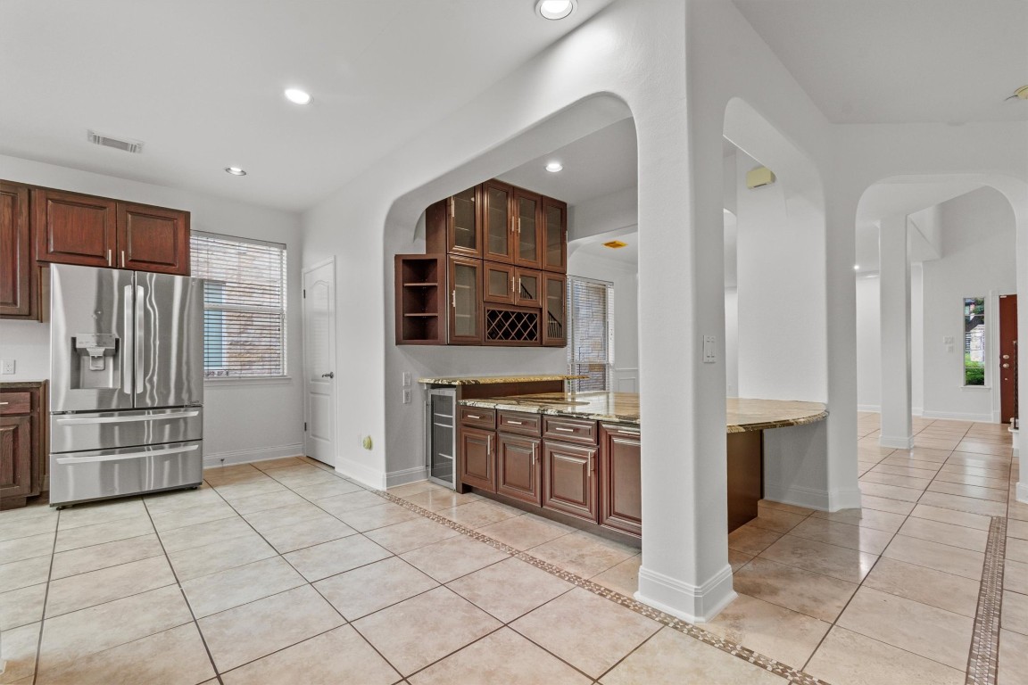 5724 Brittlyns Court Austin, TX 78730 - Photo 12 of 40 a kitchen with stainless steel appliances granite countertop a refrigerator and a stove top oven
