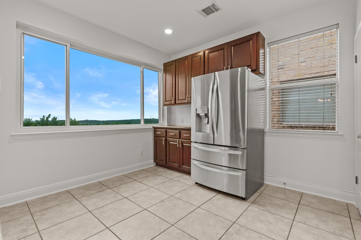 5724 Brittlyns Court Austin, TX 78730 - Photo 13 of 40 a kitchen with stainless steel appliances a refrigerator and a sink