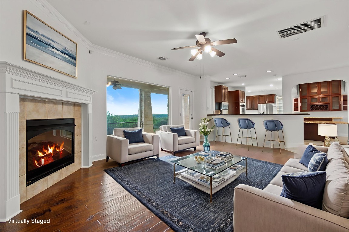 5724 Brittlyns Court Austin, TX 78730 - Photo 16 of 40 a living room with furniture and a fireplace