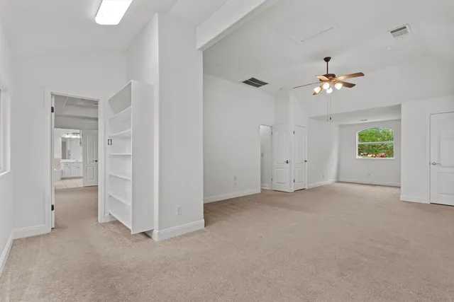 a front view of a house with a garden and yard