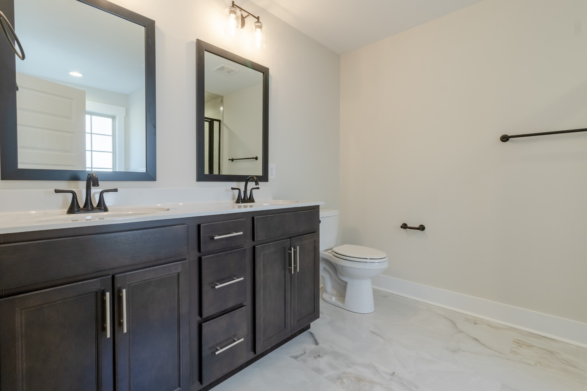 846 Limestone Way Clarksville, TN 37043 - Photo 16 of 30 a bathroom with a toilet a sink a and mirror
