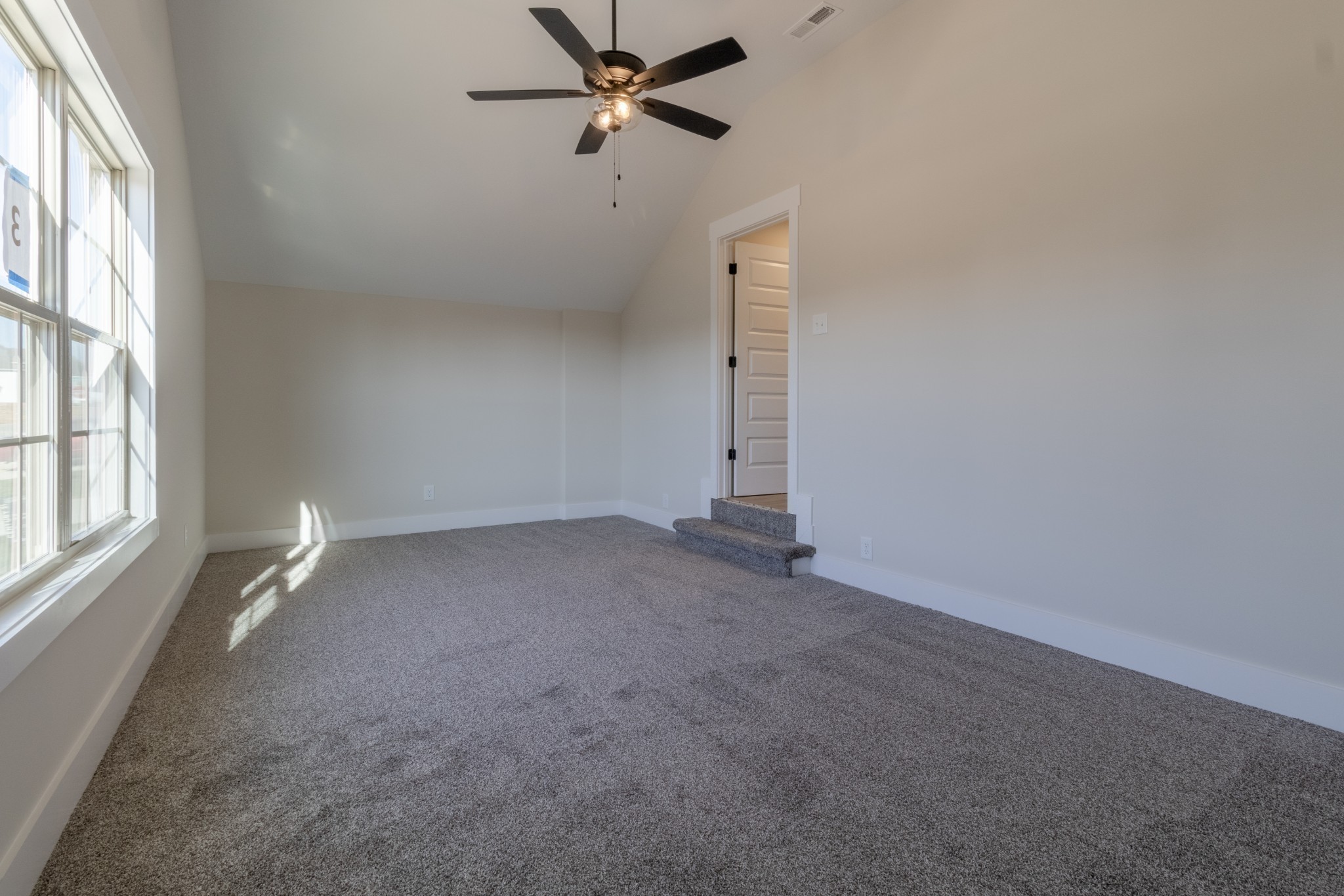 846 Limestone Way Clarksville, TN 37043 - Photo 25 of 30 an empty room with windows and fan