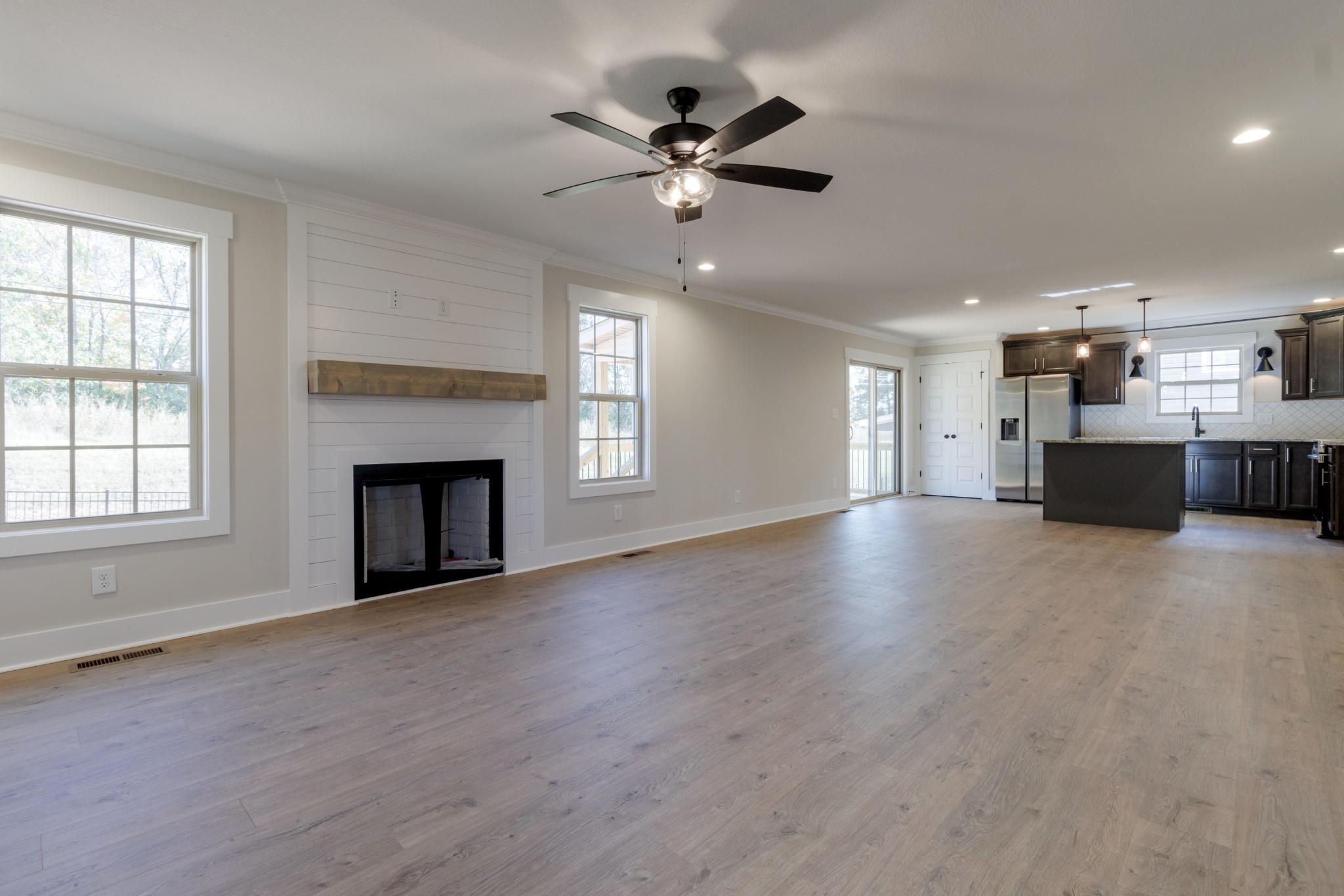 846 Limestone Way Clarksville, TN 37043 - Photo 5 of 30 a view of an empty room with a kitchen and a window