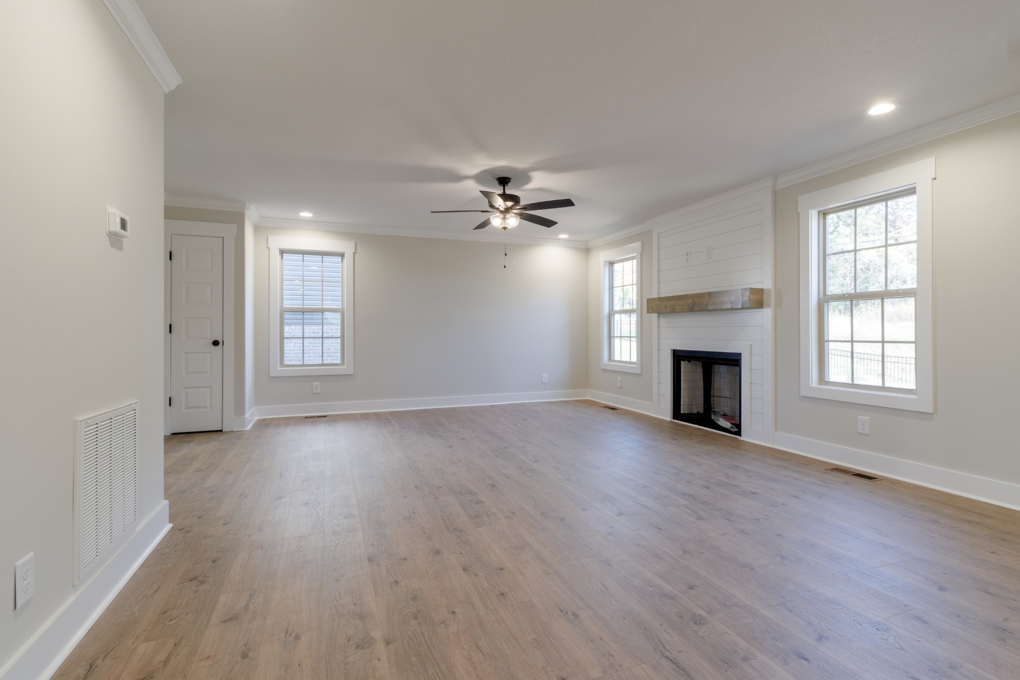 846 Limestone Way Clarksville, TN 37043 - Photo 7 of 30 an empty room with windows and a fireplace