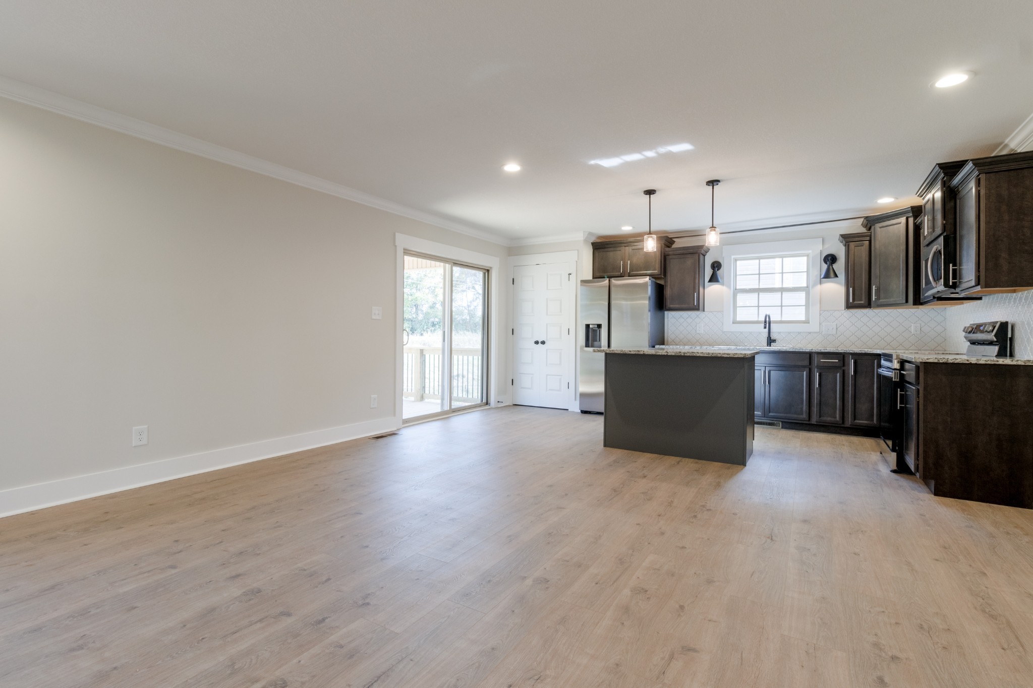 846 Limestone Way Clarksville, TN 37043 - Photo 8 of 30 a view of kitchen with wooden floor and electronic appliances