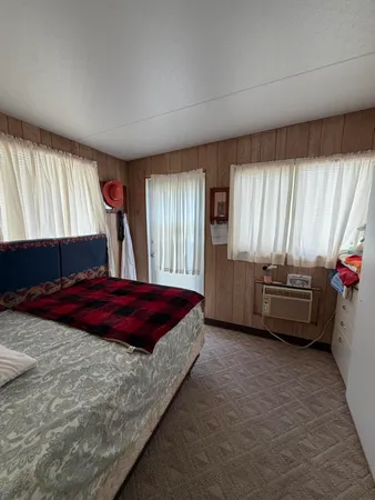 a bedroom with a bed and a couch