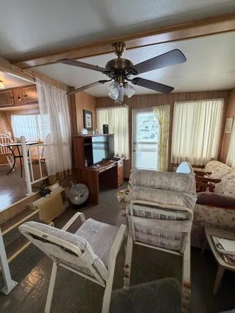 a kitchen with a stove and a chandelier