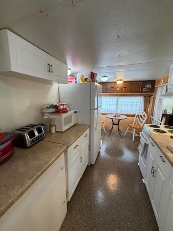 a kitchen with kitchen island granite countertop lots of counter top space