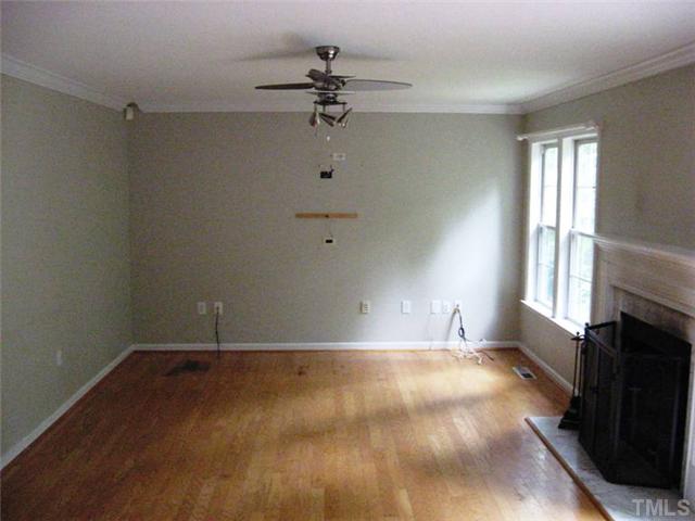 224 Crossfire Road Holly Springs, NC 27540 - Photo 5 of 7 wooden floor in an empty room with a window