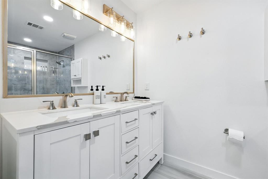 1009 Walnut Street Irving, TX 75060 - Photo 19 of 39 Full bath with a stall shower, double vanity, and recessed lighting