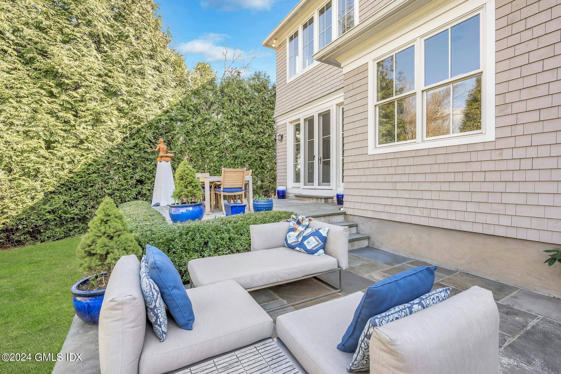 11 Meyer Place Riverside, CT 06878 - Photo 31 of 38 a view of a patio with couches table and chairs and potted plants