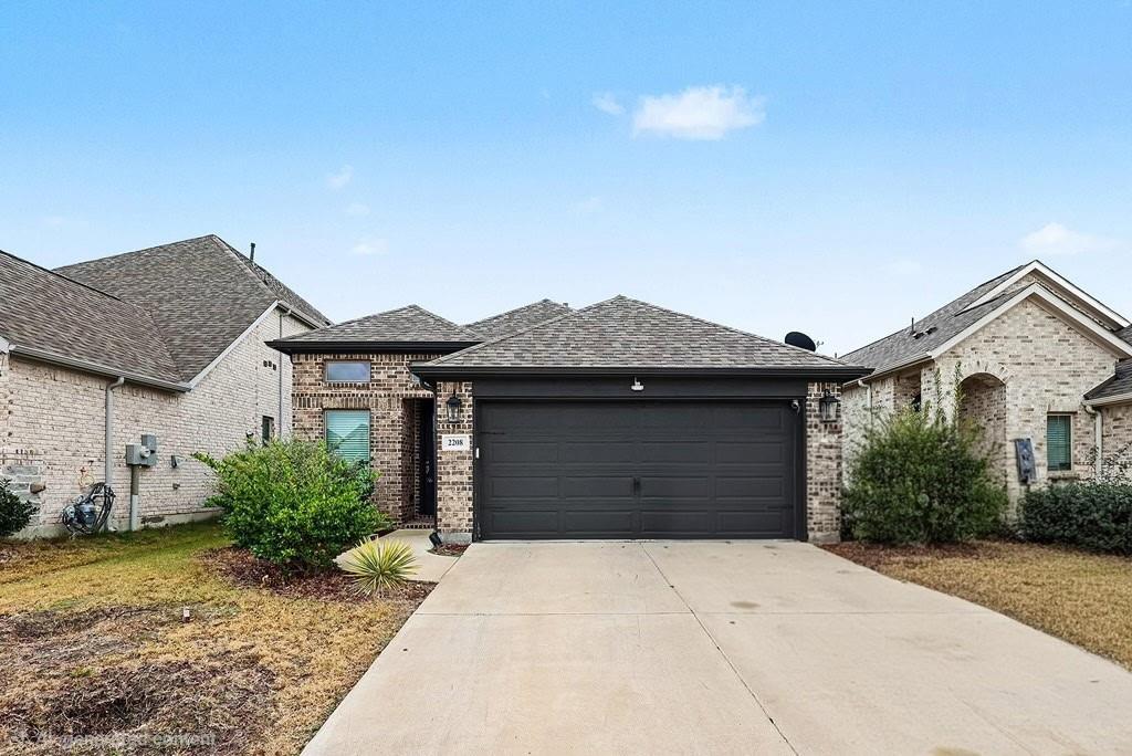 2208 Rothbury Drive Forney, TX 75126 - Photo 1 of 15 a house view with a garden space