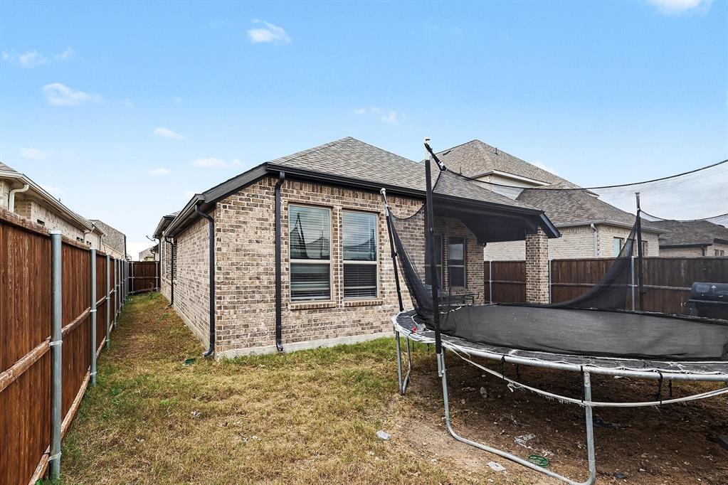 2208 Rothbury Drive Forney, TX 75126 - Photo 15 of 15 a house view with a backyard space