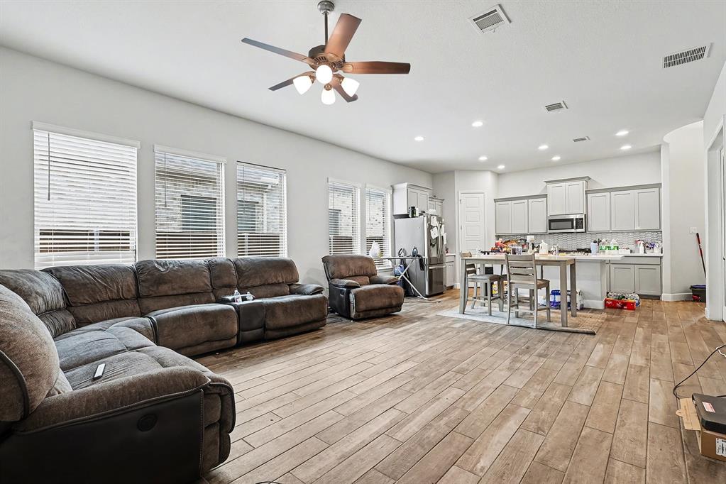 2208 Rothbury Drive Forney, TX 75126 - Photo 2 of 15 a living room with furniture and kitchen view