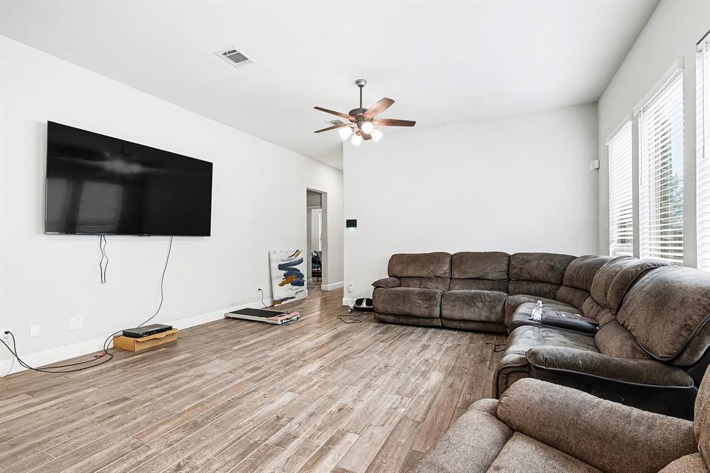 2208 Rothbury Drive Forney, TX 75126 - Photo 3 of 15 a living room with furniture and a flat screen tv