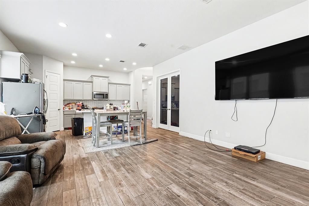 2208 Rothbury Drive Forney, TX 75126 - Photo 4 of 15 a living room with furniture and a flat screen tv