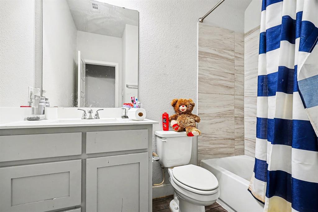 2208 Rothbury Drive Forney, TX 75126 - Photo 6 of 15 a bathroom with a sink mirror and toilet