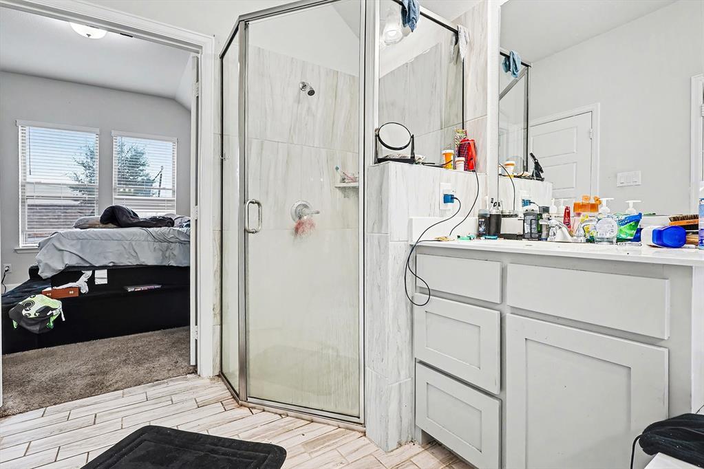 2208 Rothbury Drive Forney, TX 75126 - Photo 9 of 15 a bathroom with a sink and a shower