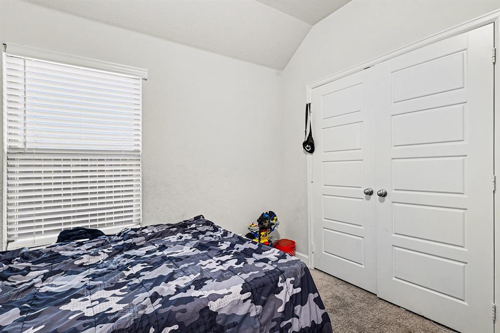 2208 Rothbury Drive Forney, TX 75126 - Photo 10 of 15 a bedroom with a bed and a window