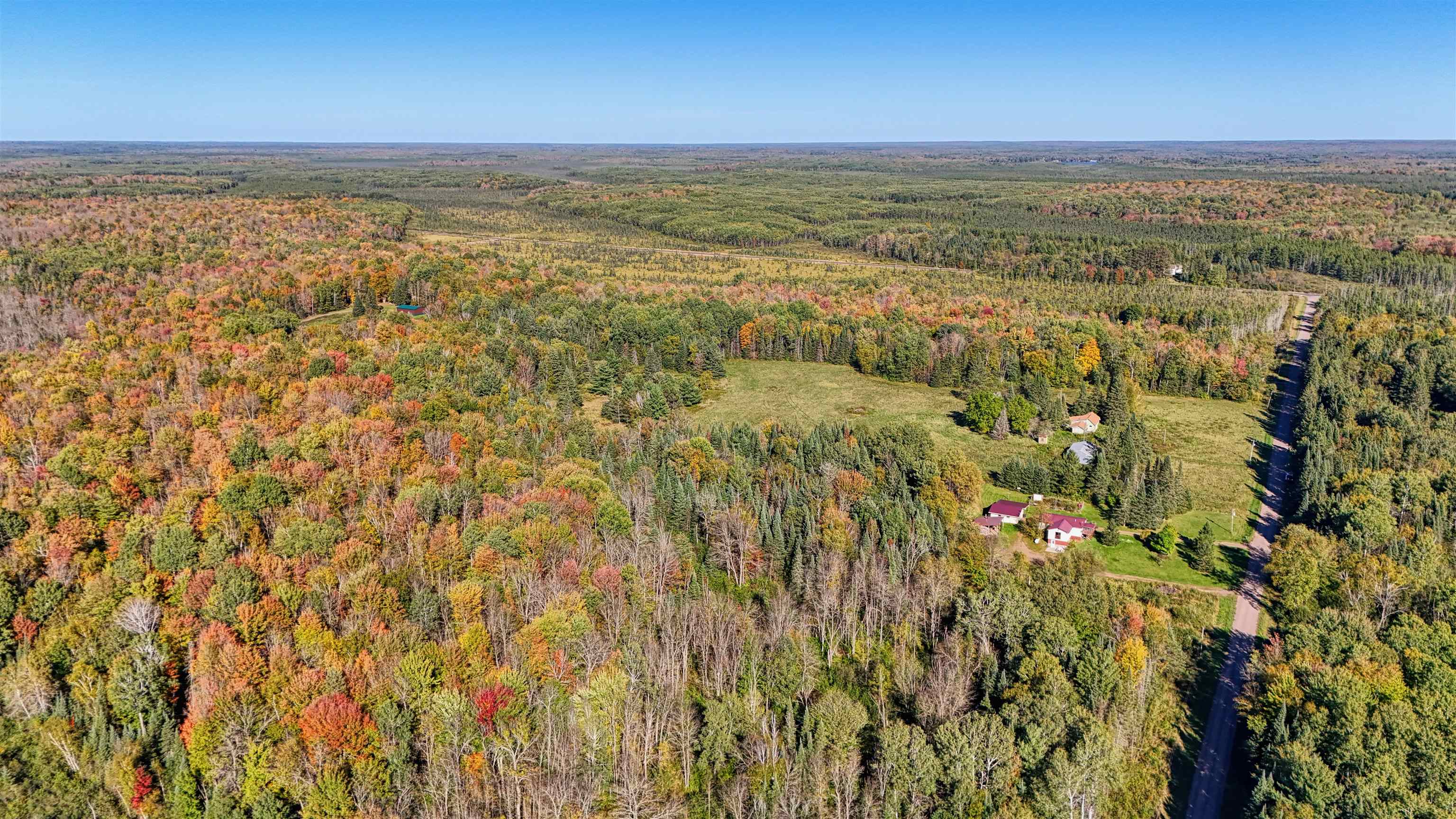 8.31-acres On Fadness Road Winter, WI 54896 - Photo 5 of 27 Aerial view of property and surrounding area featuring a forest