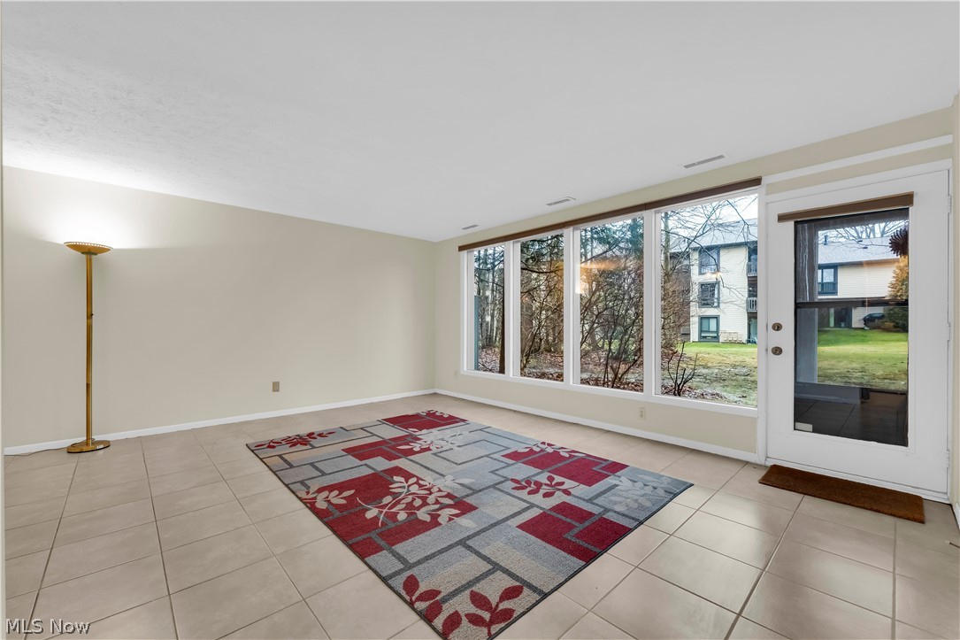 985 Canyon View Road, Unit 108D Northfield, OH 44067 - Photo 6 of 18 Empty room featuring light tile patterned floors