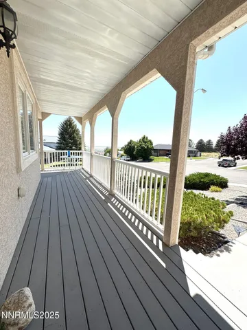 a view of balcony with wooden floor