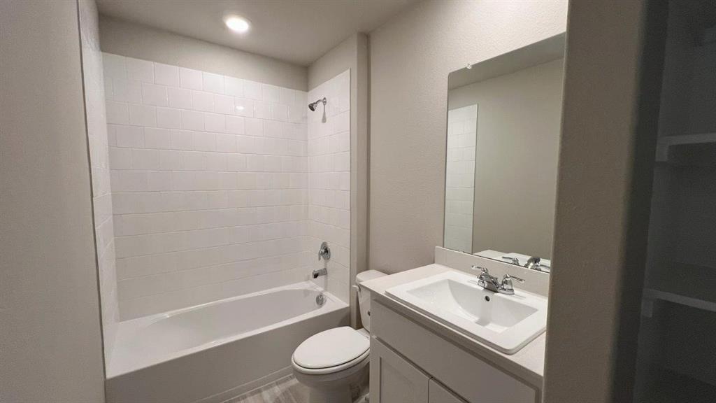 829 Round Robin Lane Rhome, TX 76078 - Photo 15 of 27 a bathroom with a sink toilet tub and shower