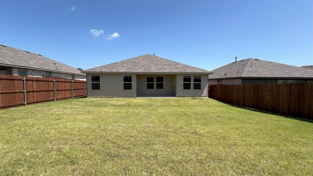 829 Round Robin Lane Rhome, TX 76078 - Photo 17 of 27 a front view of a house with a garden