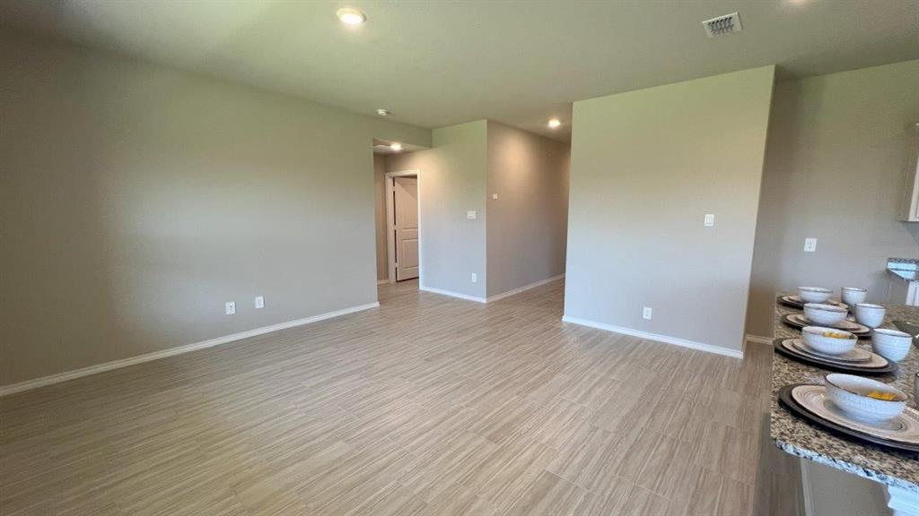 829 Round Robin Lane Rhome, TX 76078 - Photo 5 of 27 a view of a room with wooden floor